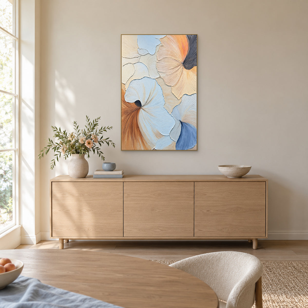 Pastel abstract in a champagne-coloured frame above an oak sideboard, with a flower vase at the left