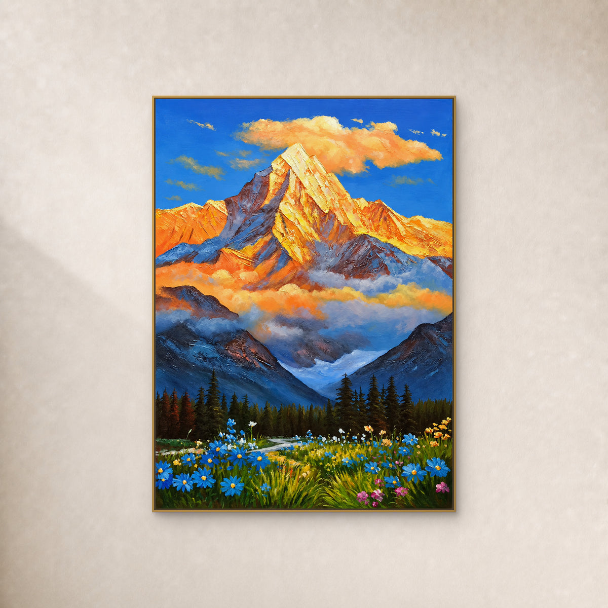 Golden mountain above blue mist, evergreen forest and a wildflower meadow, in a slim gold floating frame on an ivory wall