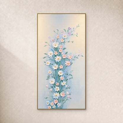 Tableau vertical de fleurs blanches et roses aux tiges vertes, dans un fin cadre doré sur un mur ivoire