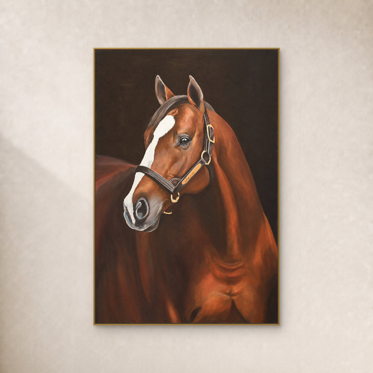 Brown horse with a white blaze and dark halter, in a thin gold-tone floating frame on a warm ivory wall