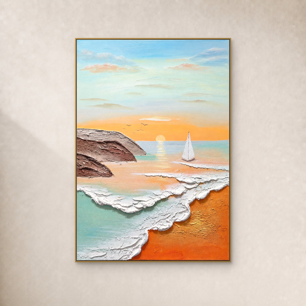 Sunrise, a white sail and raised waves on a turquoise and apricot coast, in a slim gold-tone frame on an ivory wall
