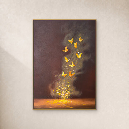 Nine golden butterflies on a dark brown painting in a thin gold floating frame against a warm ivory wall