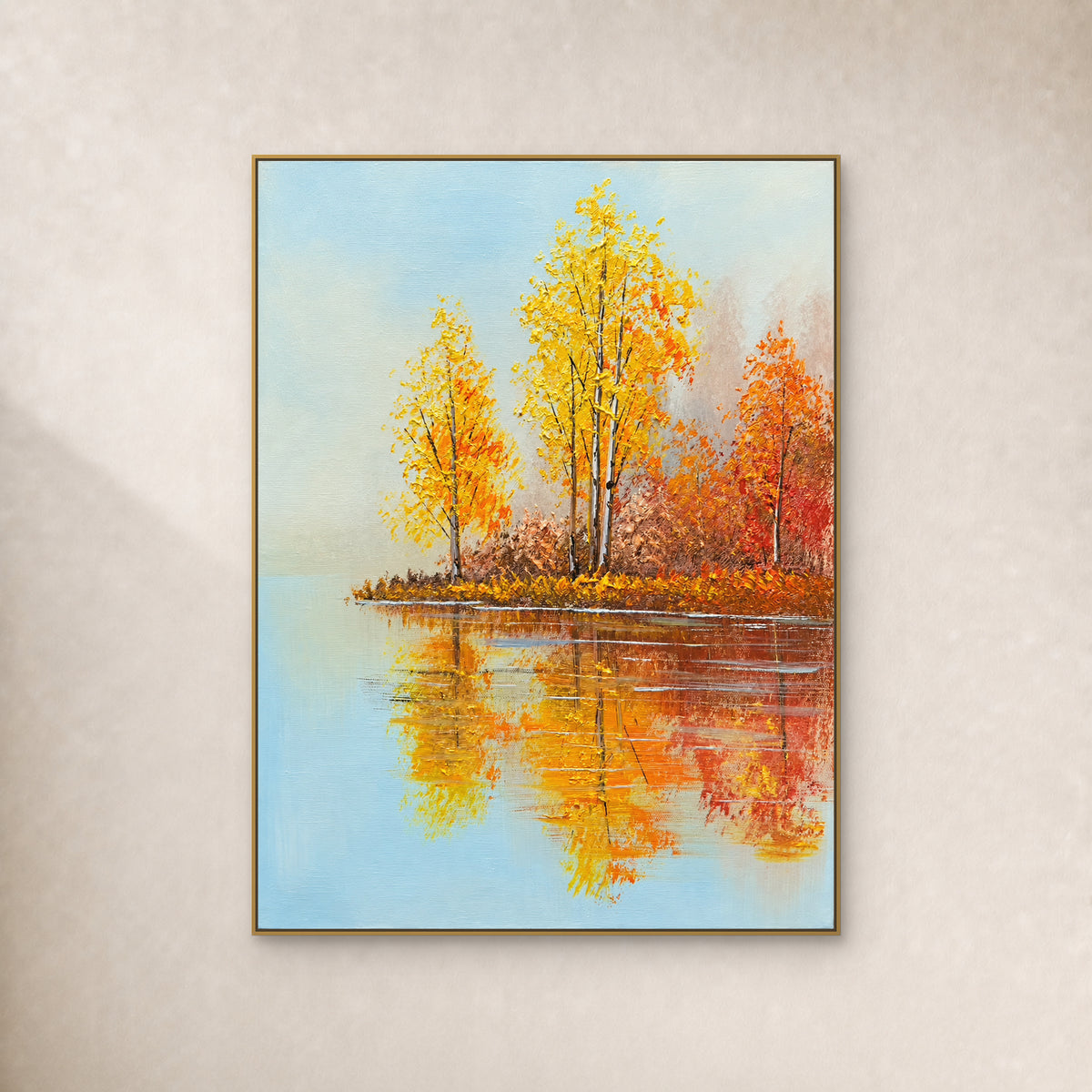 Golden birches and orange foliage reflected in a pale blue lake, in a thin gold frame on an ivory wall