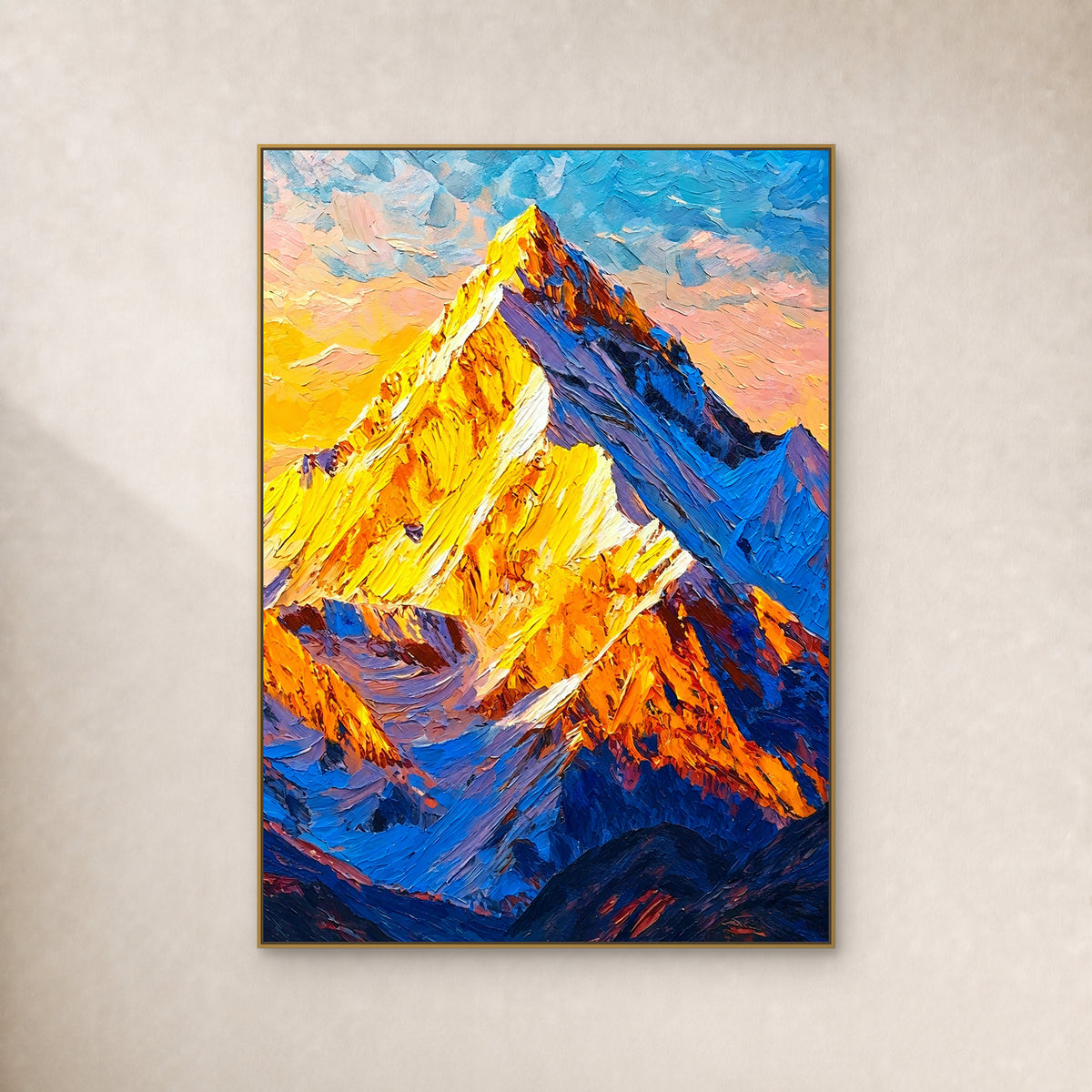 Golden-yellow mountain peak with cobalt slopes, in a slim gold-tone floating frame on an ivory wall
