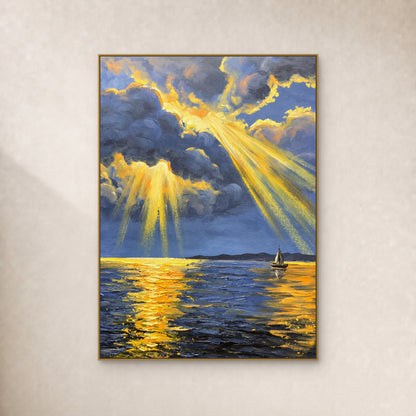 Blue-grey clouds open into golden sunbeams over a small sailboat, in a thin gold frame on an ivory wall.