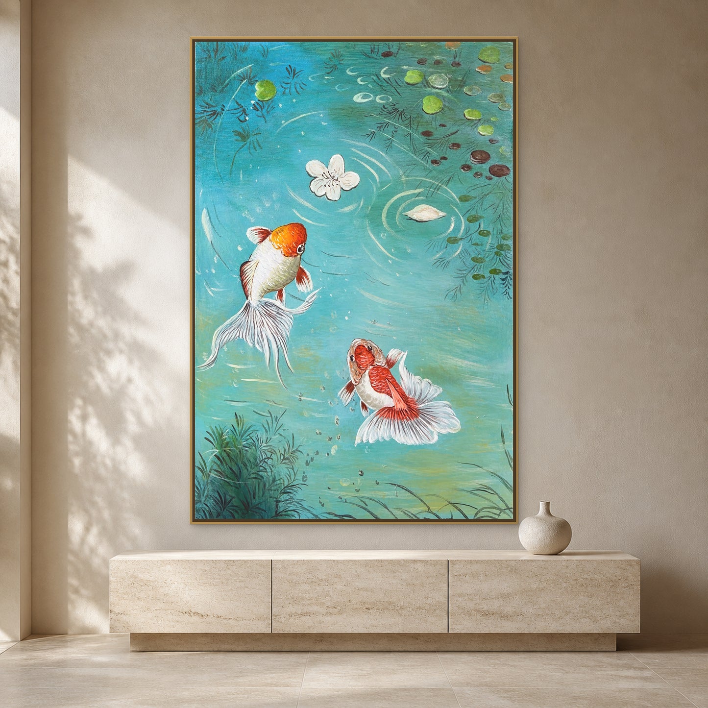 Two koi in a turquoise pond painting in a thin gold floating frame on a warm ivory wall