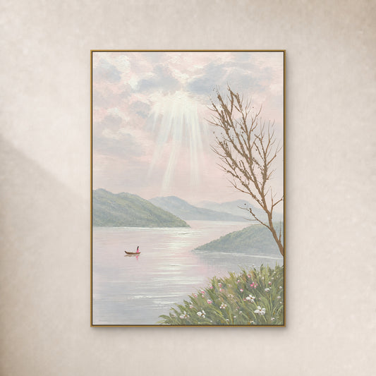 Pastel lake painting with a tiny boat and light rays in a thin gold frame on an ivory wall