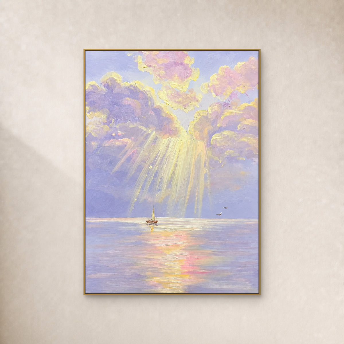 Pale yellow rays break through lilac clouds above a small sailboat, in a slim gold frame on an ivory wall.