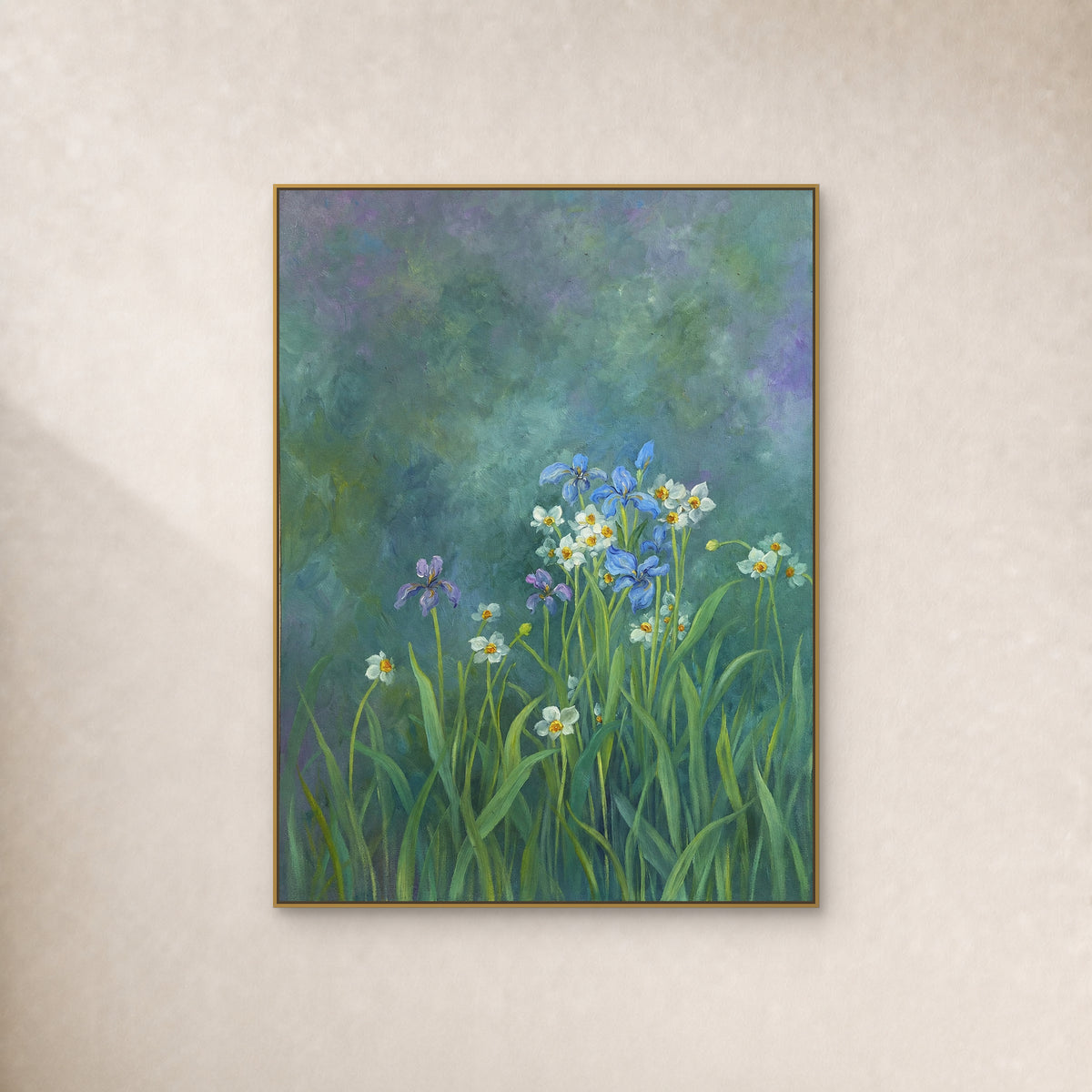 Blue and violet irises with white flowers on a teal ground, displayed in a slim gold floating frame on an ivory wall
