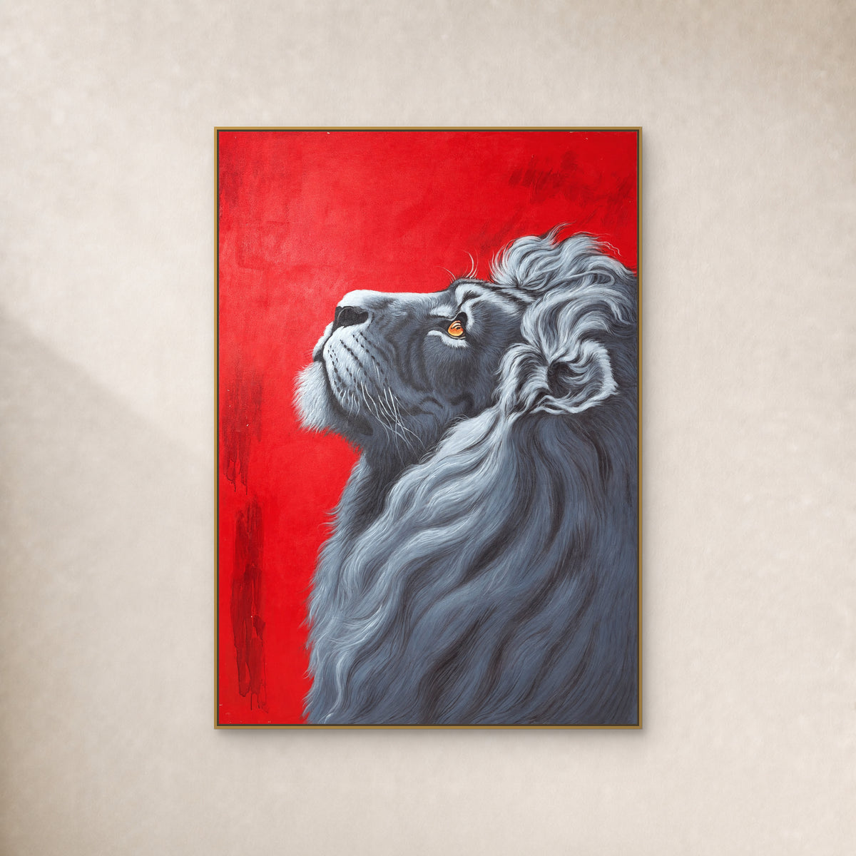 Silver-grey lion looking upward against a scarlet background, in a thin gold-tone floating frame on an ivory wall