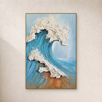 Sculpted blue wave with raised ivory foam in a thin gold floating frame on an ivory wall