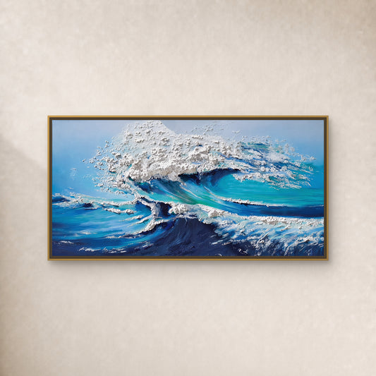 Turquoise breaking-wave painting with raised white foam in a slim gold frame on an ivory wall