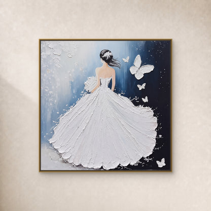 Square painting of a woman in a textured white gown with butterflies against blue, in a slim gold-tone frame on an ivory wall