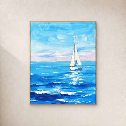 White sailboat on turquoise and cobalt waves beneath a blue sky, in a slim gold frame against an ivory wall.