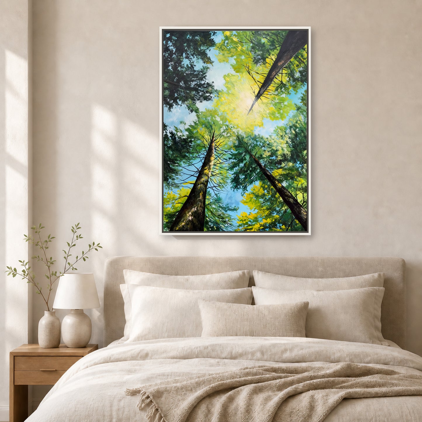 Light Through the Trees in a slim white floating frame above a neutral upholstered bed