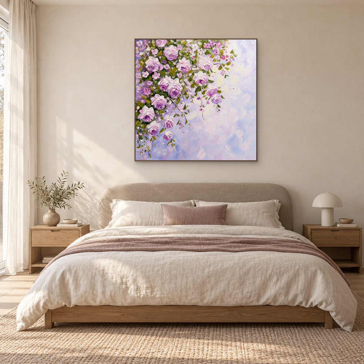 Lilac and pink rose painting in an oak-toned frame above a cream upholstered bed