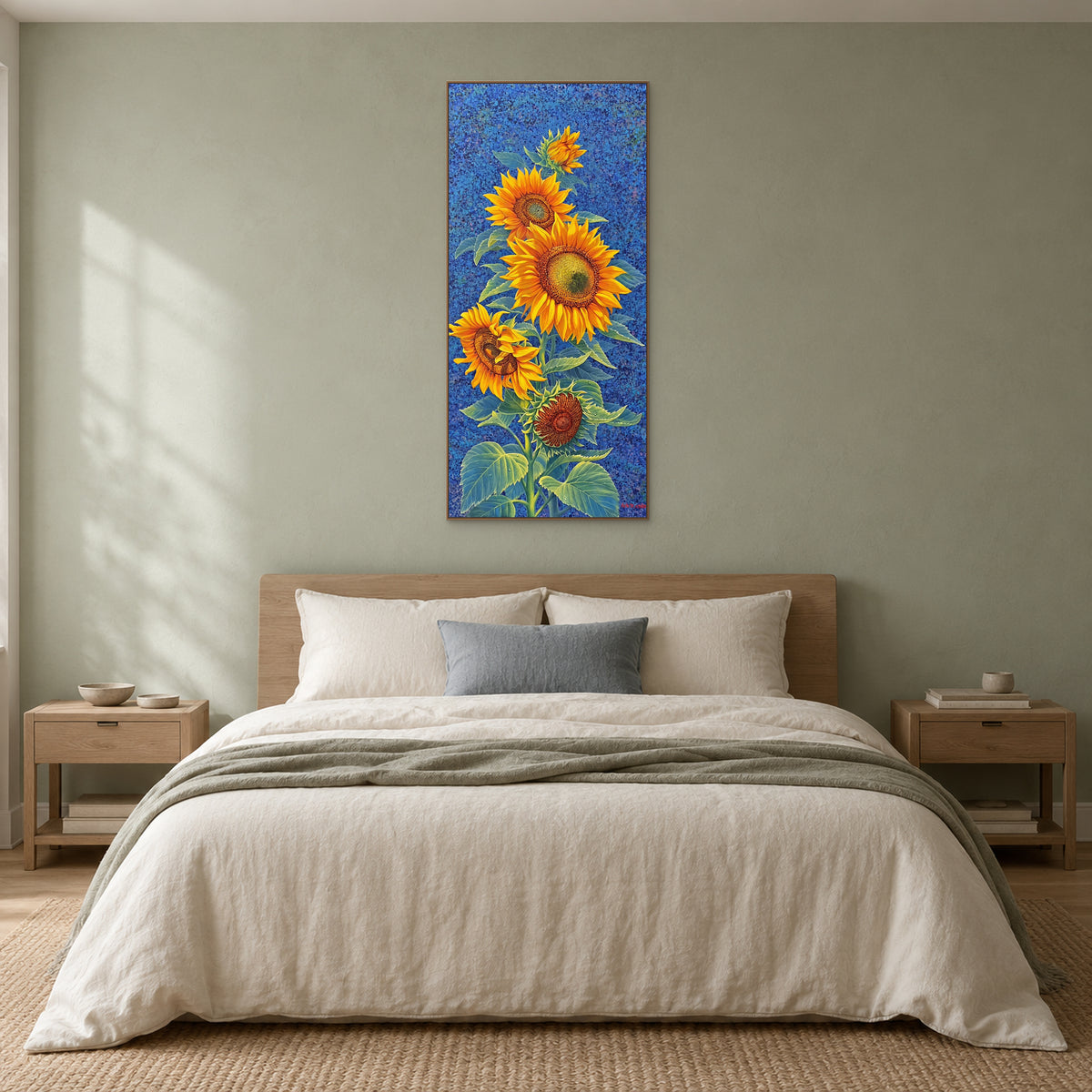 Narrow sunflower artwork in an oak-tone frame centred above a wooden headboard and neutral bedding
