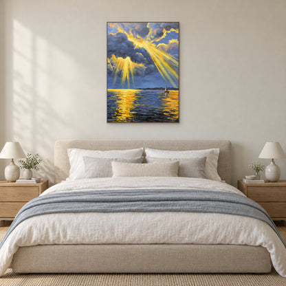 Golden sunbeam seascape in an oak-tone floating frame above an upholstered bed with blue-grey bedding.