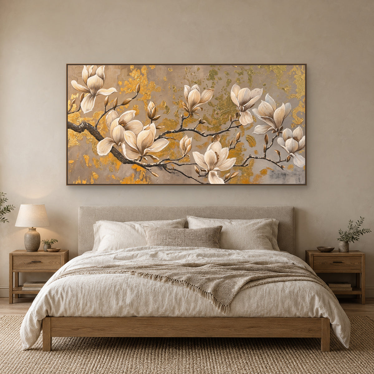Wide cream magnolia painting in an oak-toned frame, centred above an upholstered bed