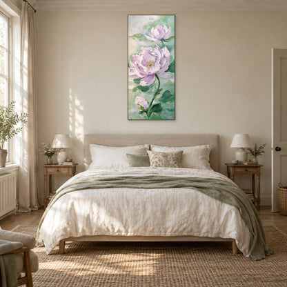 Lilac peony painting in an oak-tone floating frame centred above a linen bed in a warm neutral bedroom