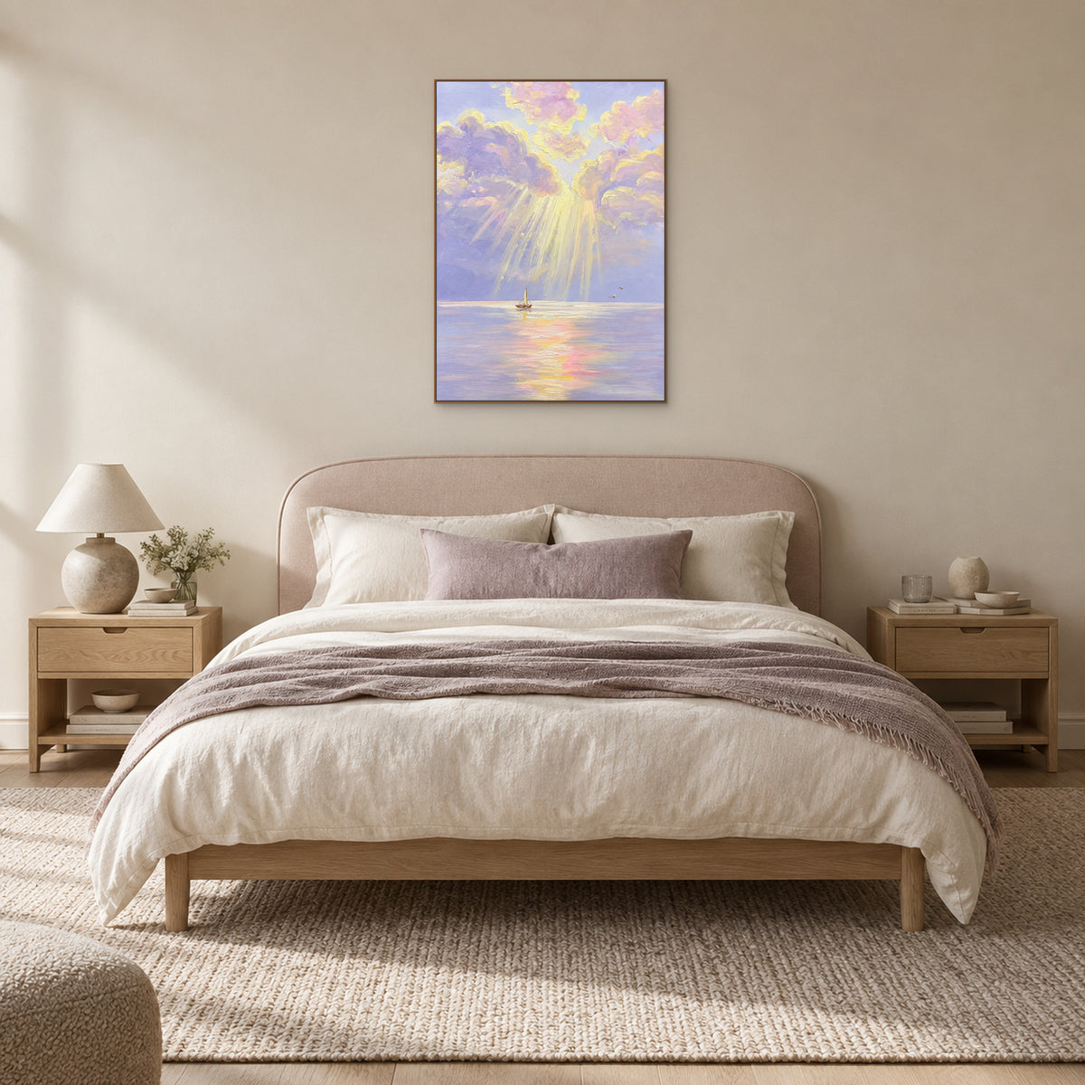 Lilac and yellow seascape in an oak-look frame, centred above a blush upholstered headboard and neutral bedding.