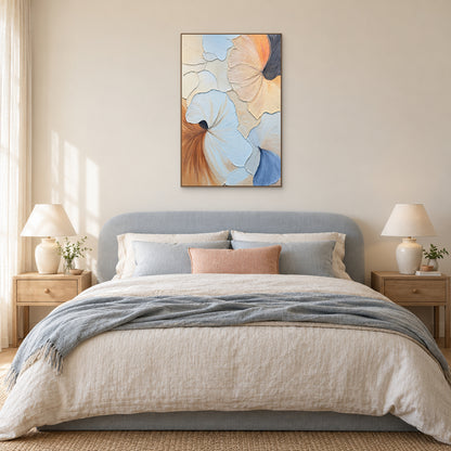 Blue and peach fan-shaped abstract in an oak-coloured frame above a pale-blue upholstered bed with a peach cushion