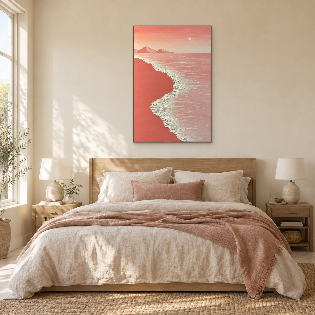 Pink Shore in an oak-look floating frame centred above a bed with warm neutral linen