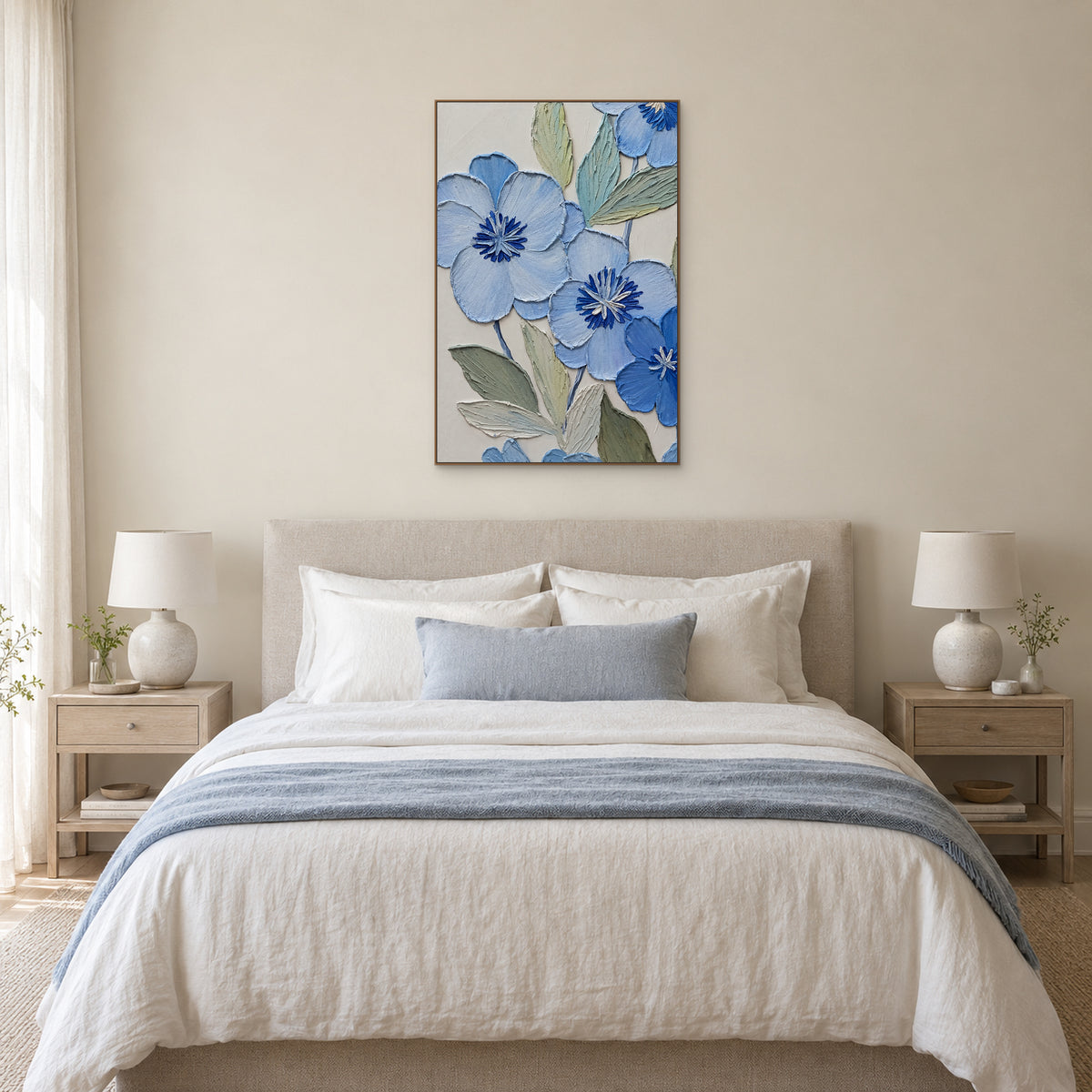 Vertical blue floral relief in an oak-tone frame centred above a cream upholstered bed