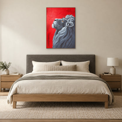 Red-background lion portrait in an oak-tone frame centred above a charcoal upholstered bed