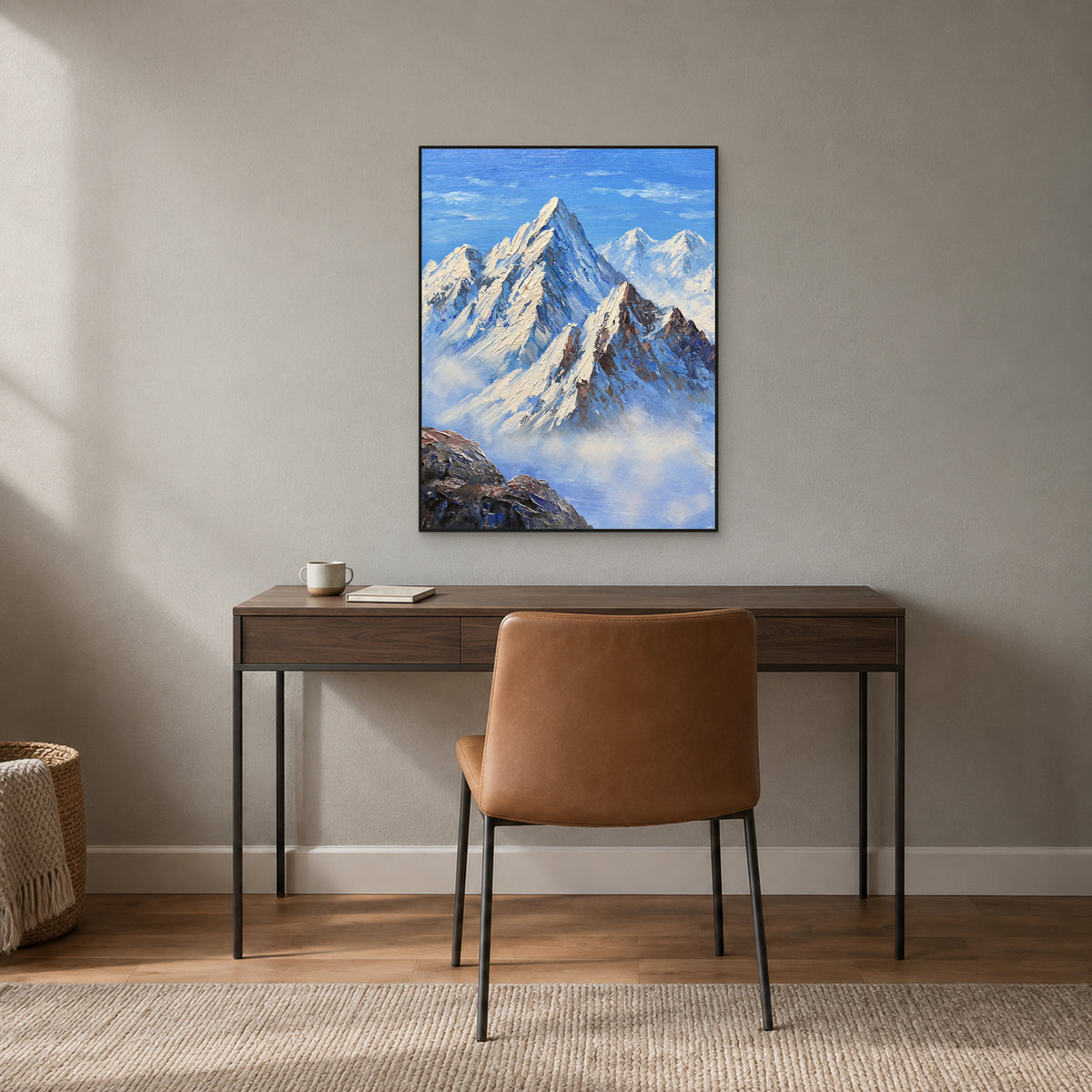 Textured blue mountain painting in a black floating frame above a walnut desk