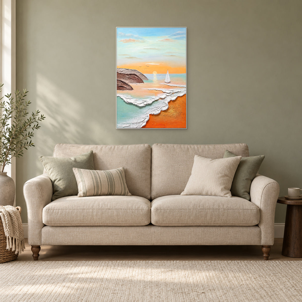 Dawn Sail seascape in a white frame above a cream settee, with an olive wall and side daylight