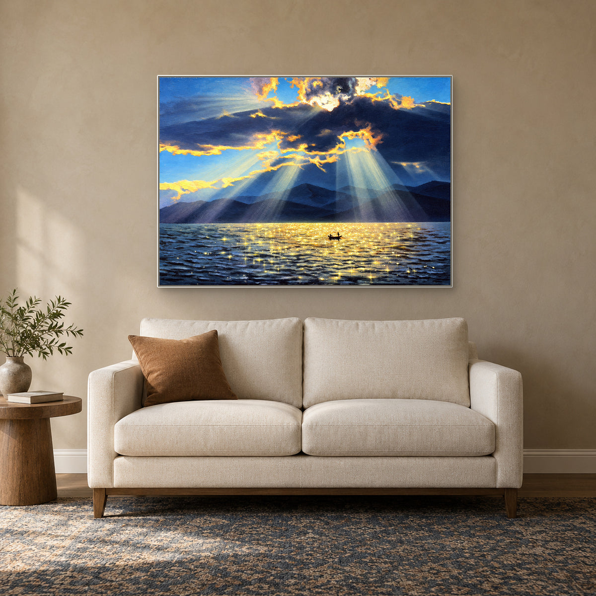 Hand-painted lake landscape in a white floating frame above an ivory loveseat in a reading nook