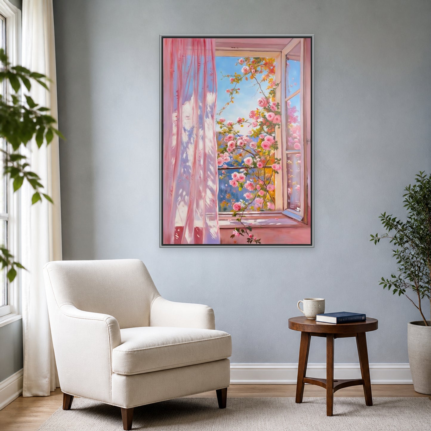 Roses at the Open Window in a slim silver floating frame beside an ivory reading chair