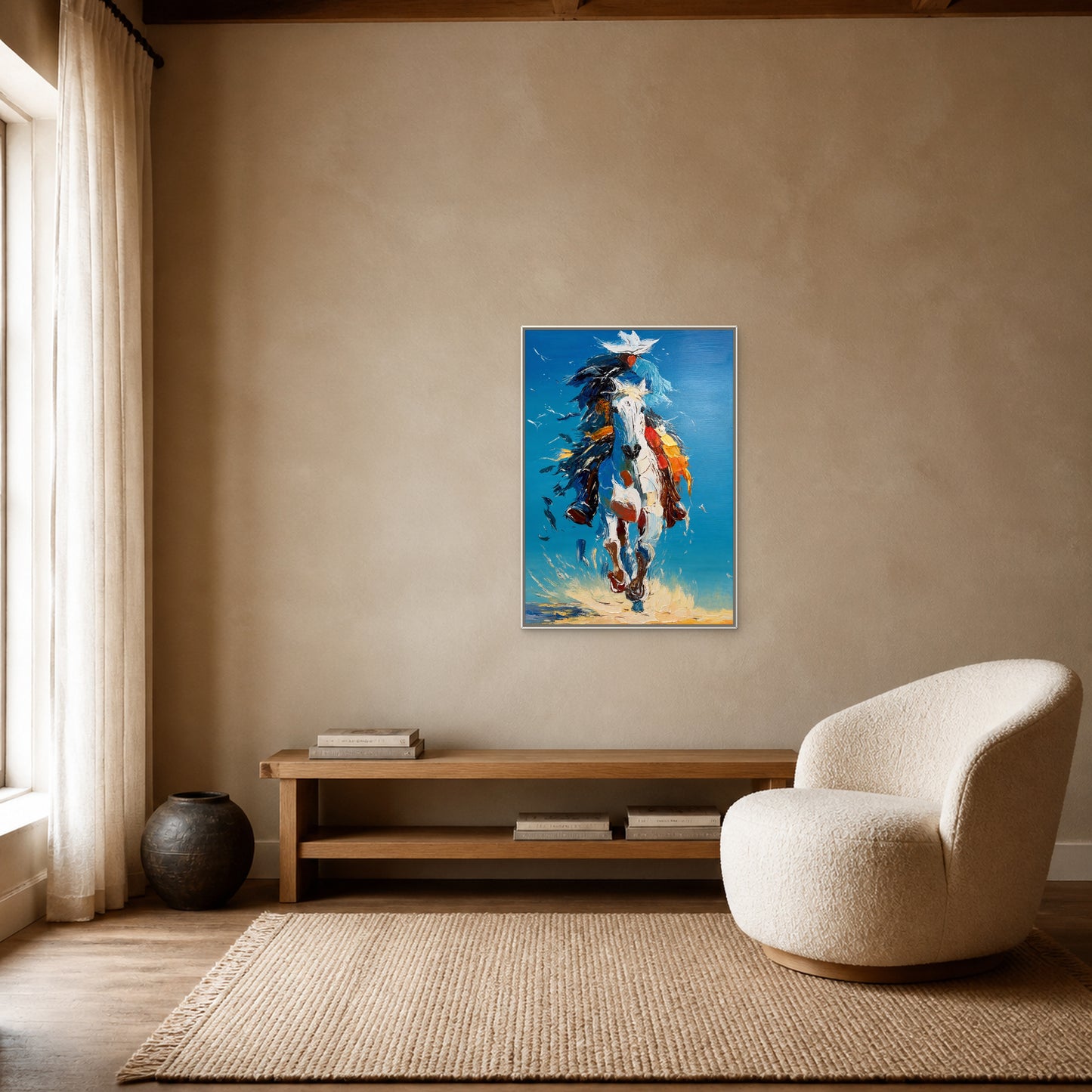 Blue Sky Gallop in a slim white floating frame above an oak book bench beside a cream reading chair