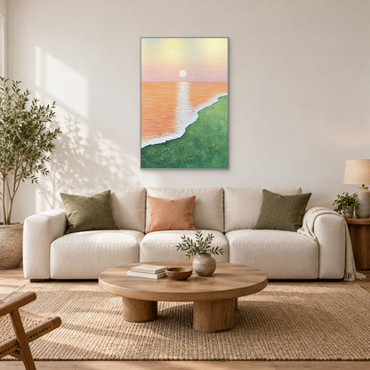 Apricot sea and green shore in a silver-tone frame centred above an ivory sofa with olive and peach cushions