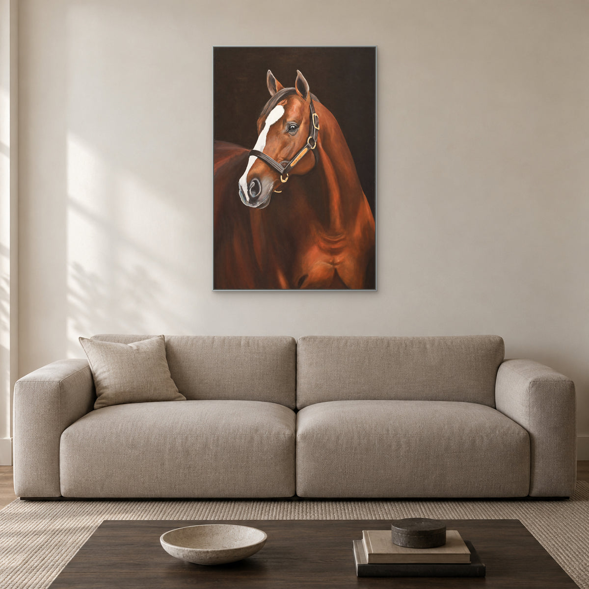 Vertical horse portrait in a silver-tone frame centred above a pale sofa