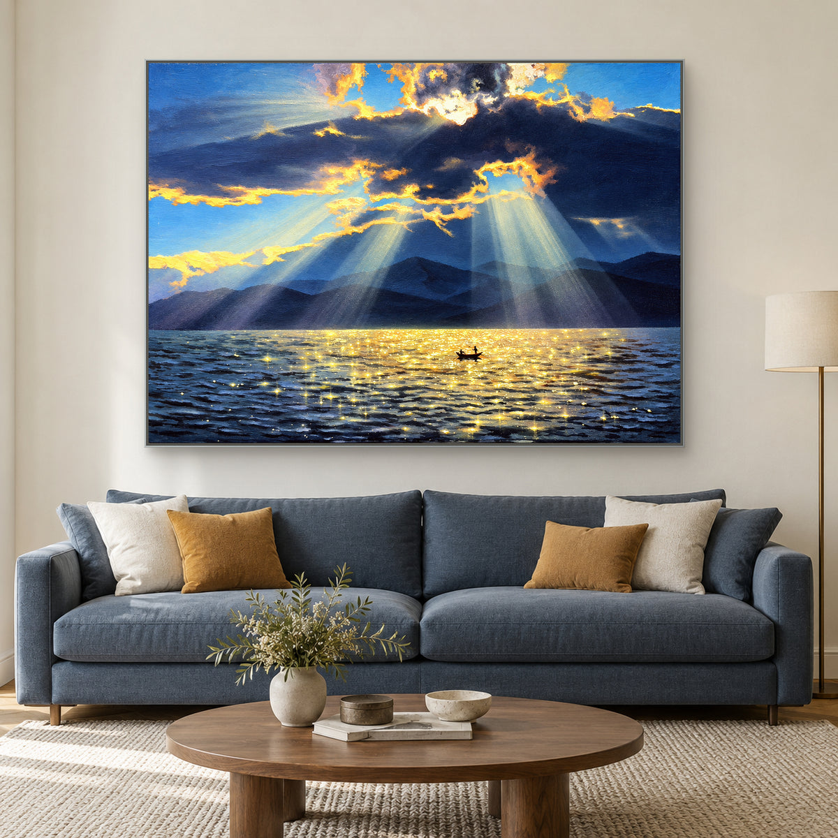 Gilded Crossing in a silver-tone frame above a blue sofa with ochre and ivory cushions