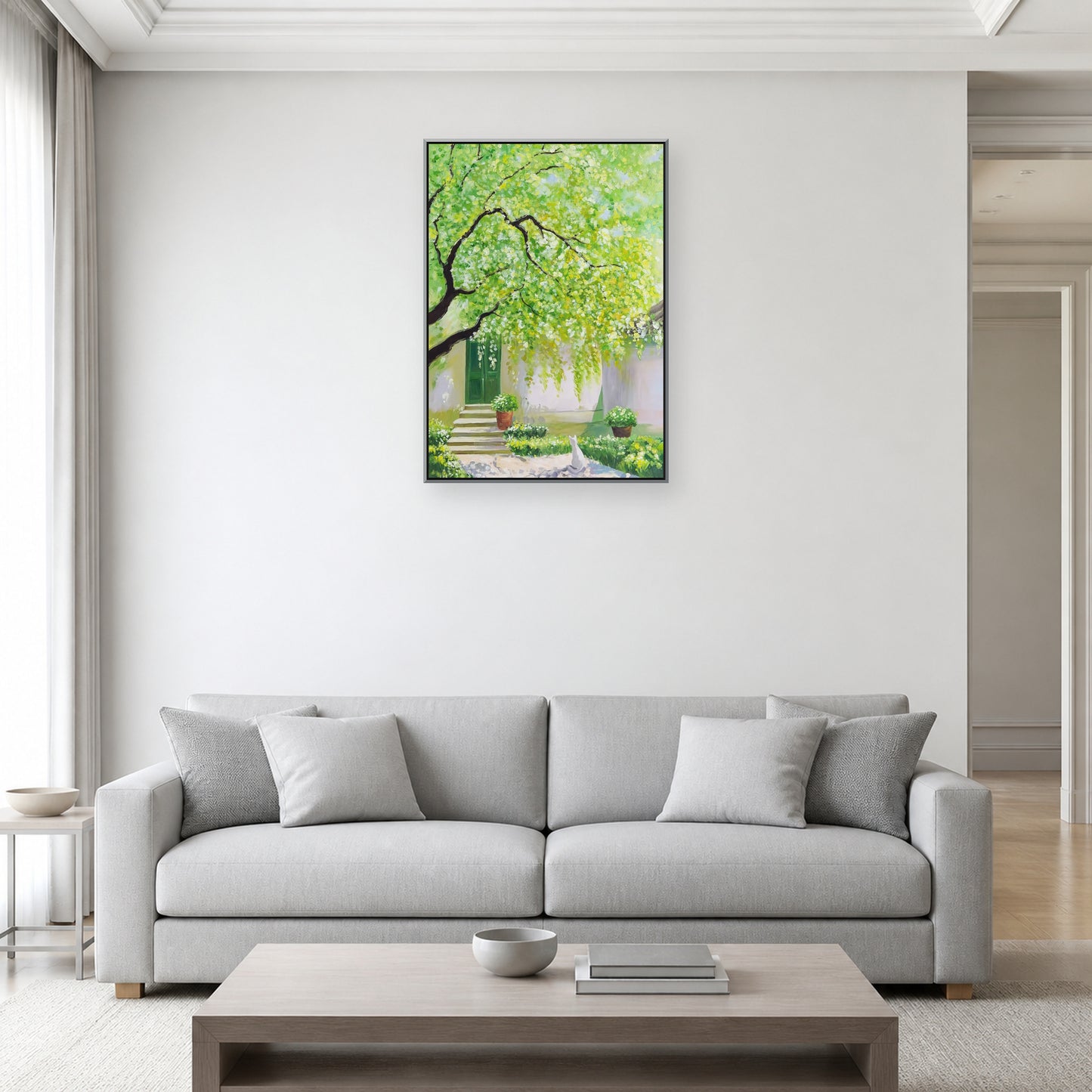 Spring Courtyard in a slim silver floating frame above a light grey living room sofa