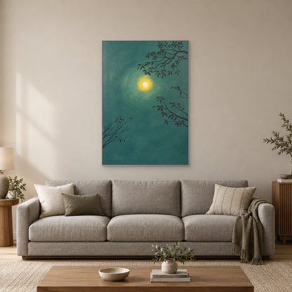 Moon and branches wall art in a silver-tone frame above a grey sofa
