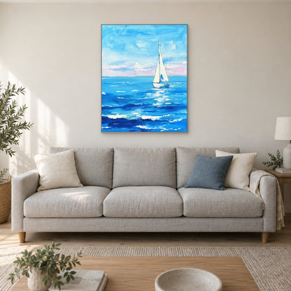 Turquoise waves and a white sailboat in a silver-tone frame above a light grey sofa.