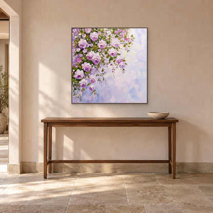 Square floral painting in a walnut-toned frame centred above a narrow wooden console