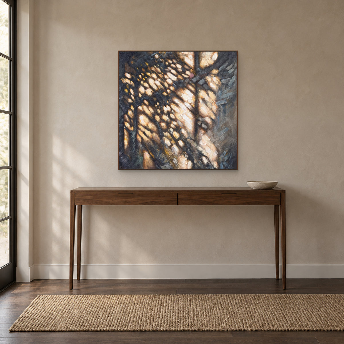 Warm ochre abstract painting in a walnut-look floating frame above an entryway console