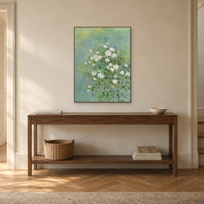 Tableau de jasmin blanc dans un cadre flottant ton noyer, au-dessus d’une console d’entrée