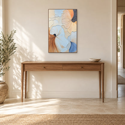 Blue, peach and cream relief painting in a walnut-coloured frame centred above a wooden entryway console