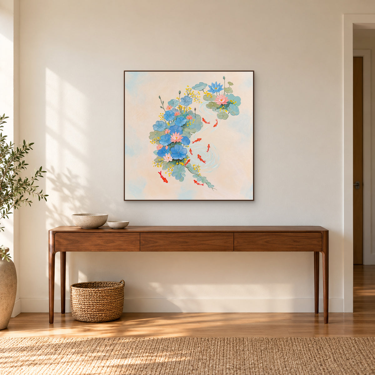 Tableau de bassin aux lotus pastel dans un cadre ton noyer au-dessus d’une console d’entrée en bois
