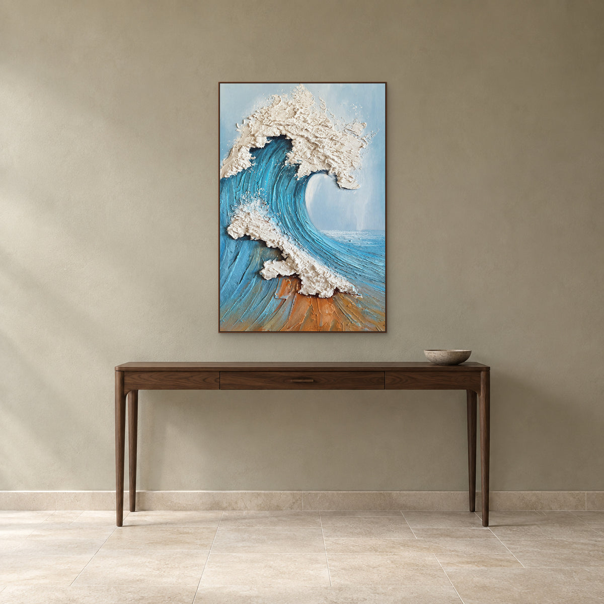 Blue wave painting in a walnut-tone floating frame above an entryway console