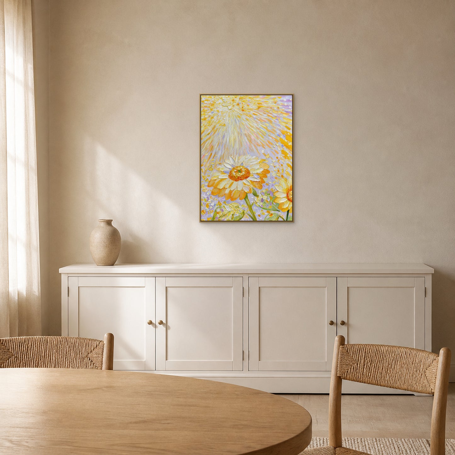 Sunflowers in Golden Light in a slim champagne floating frame centred above a painted-wood credenza in a bright dining room