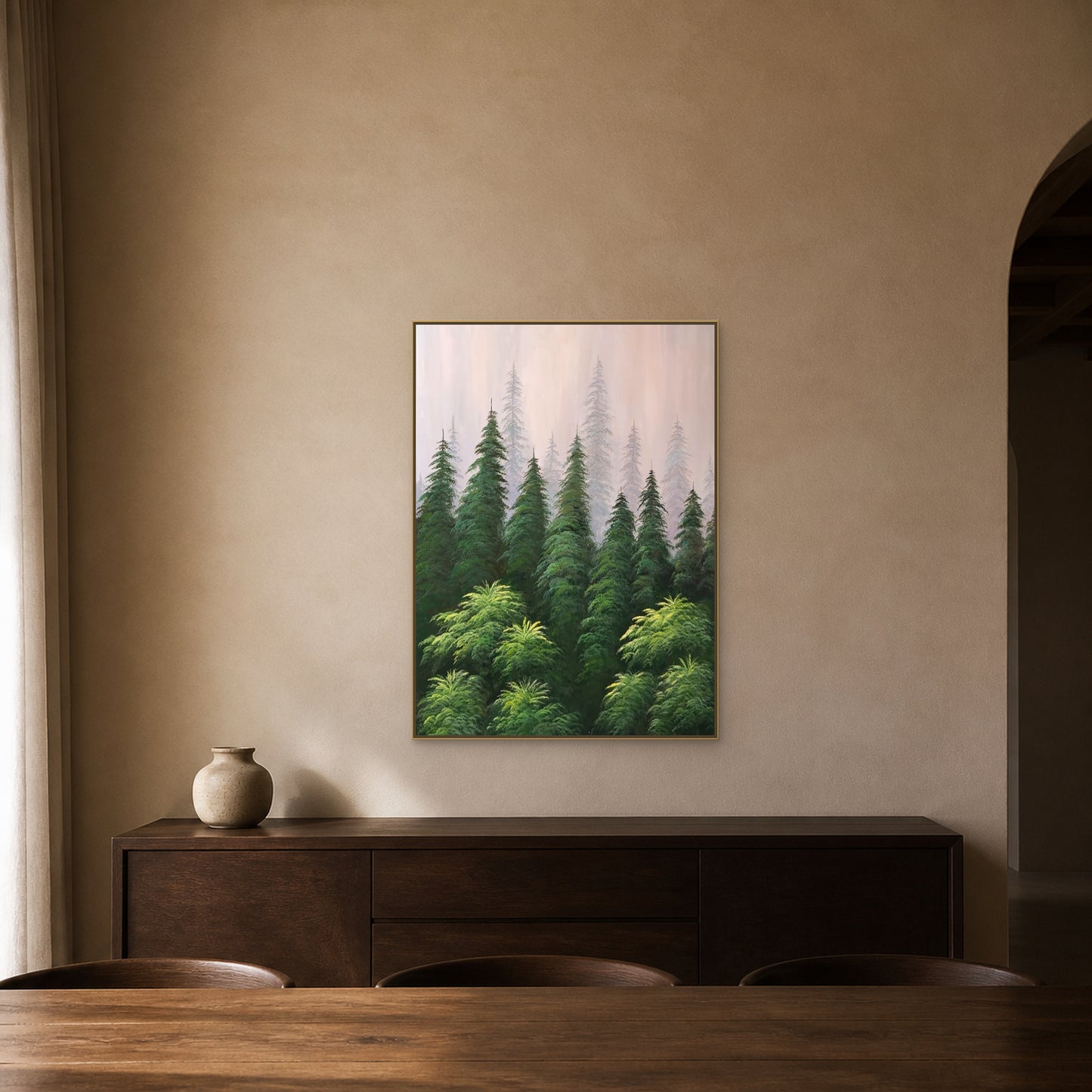 Misty pine forest painting in a slim champagne floating frame above a dark-oak dining sideboard