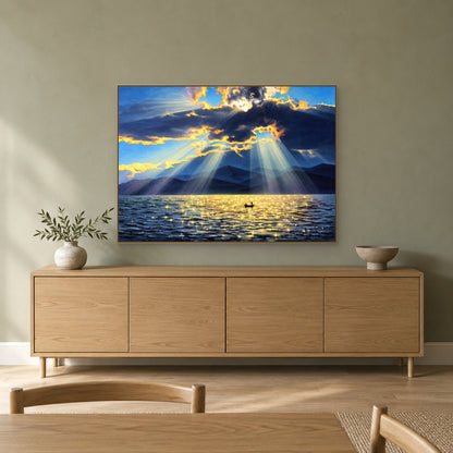 Blue and gold lake artwork in a champagne-tone frame above a wood sideboard on a sage-green wall