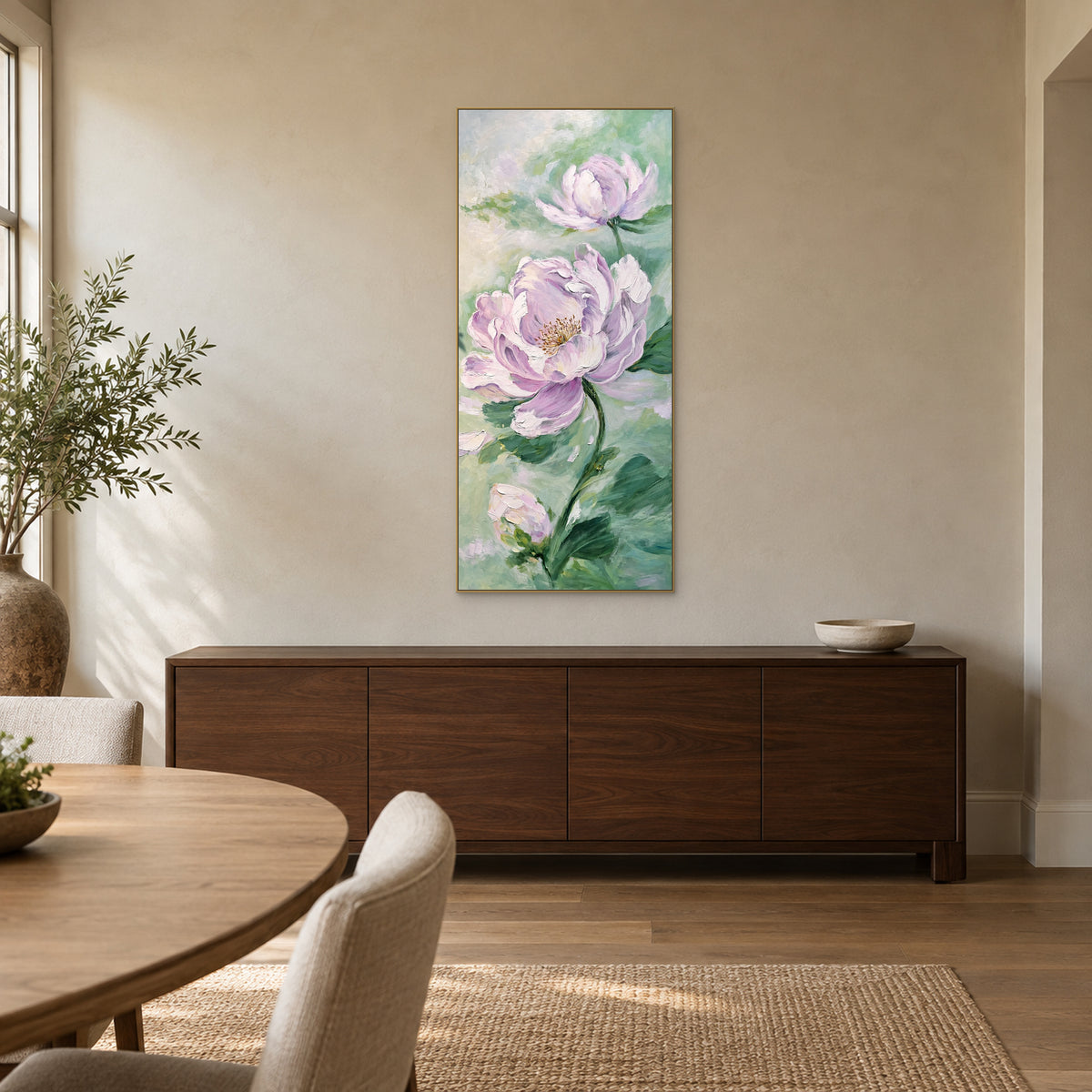 Tall lilac and mint peony painting in a champagne-coloured floating frame above a walnut-tone dining room sideboard